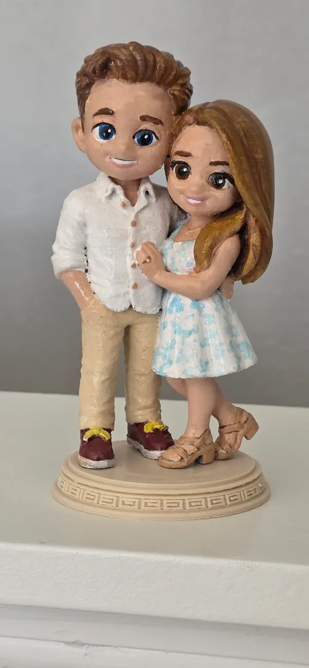Custom color wedding couple figurine photographed against neutral background