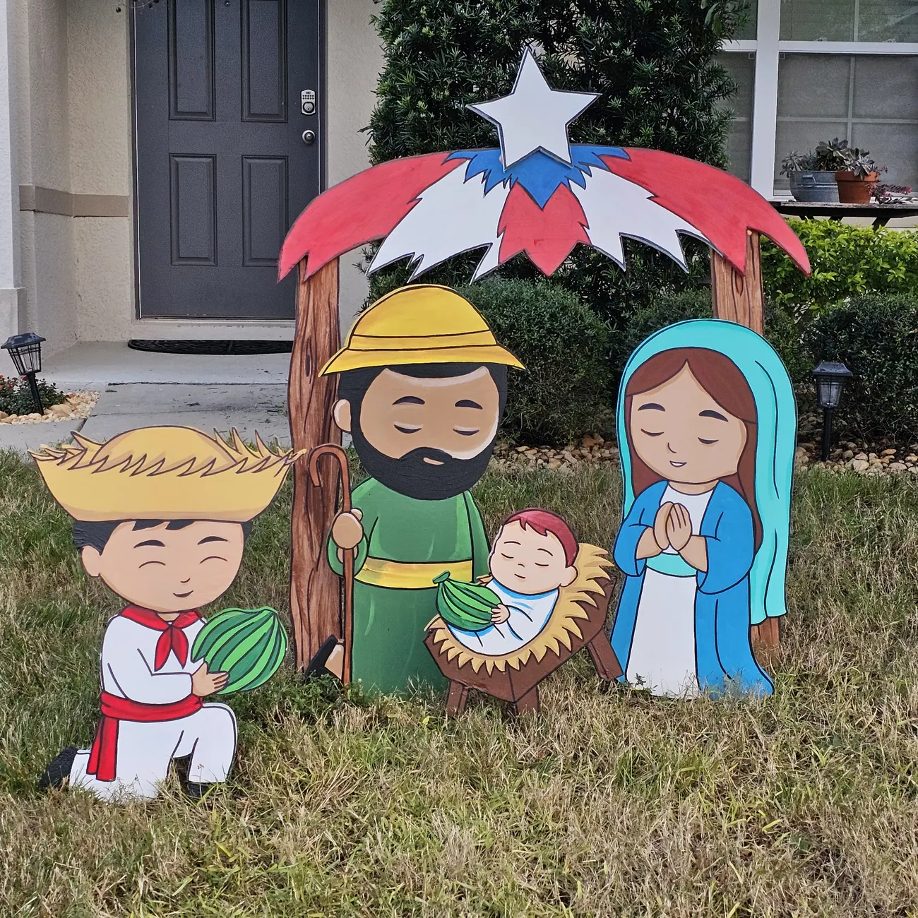 Decorative holiday lawn installation created by Pop Abstraction